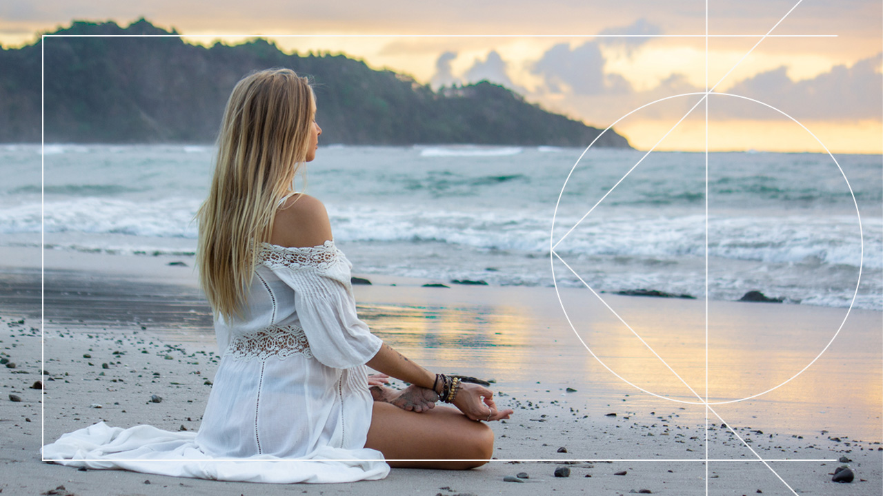 Premium Photo  Woman in blue dress doing yoga on beach